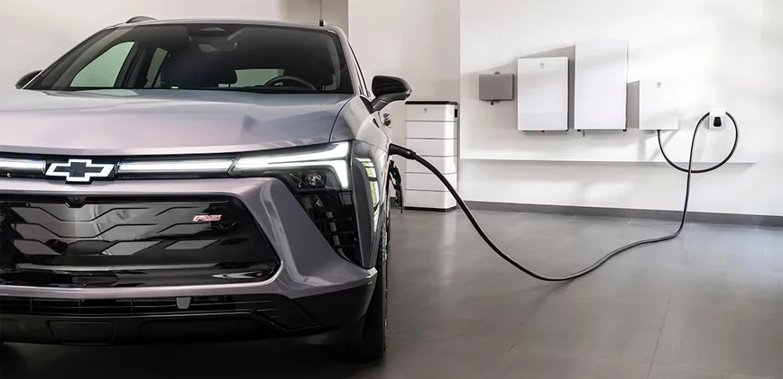 Chevrolet Bolt plugged into a home Level 2 charger in a garage