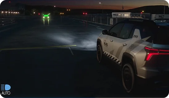 Bolt headlights illuminating a dark road with IntelliBeam active