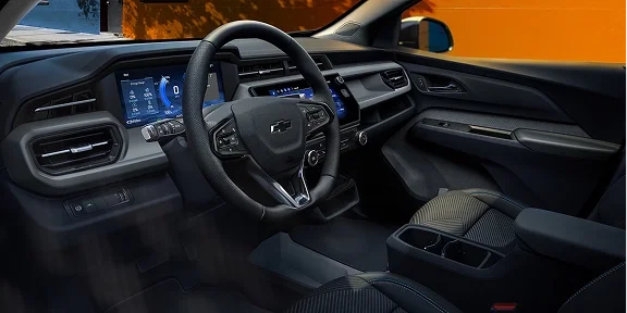 2027 Bolt driving on a scenic highway