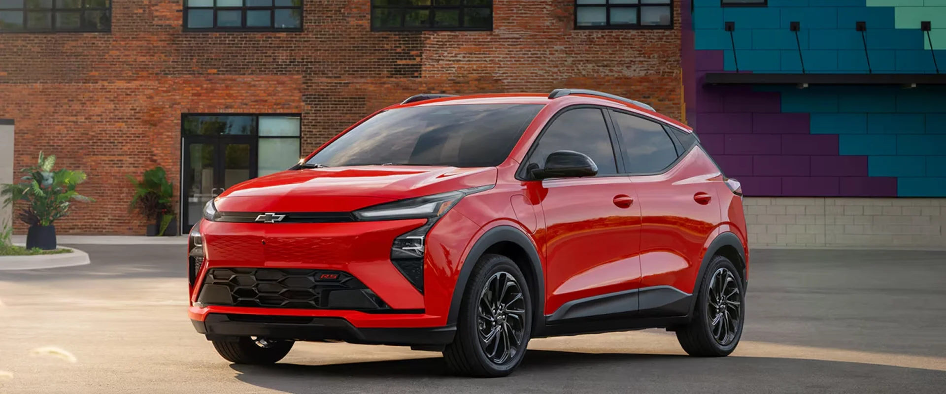 Red 2027 Chevrolet Bolt EV front three-quarter view